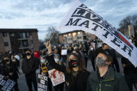 Demonstrators take part in a protest over the fatal shooting of Daunte Wright by a police officer during a traffic stop, outside the Brooklyn Center Police Department, Saturday, April 17, 2021, in Brooklyn Center, Minn. (AP Photo/John Minchillo)