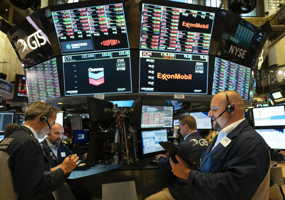 Traders work at the New York Stock Exchange, Friday, July 5, 2019 in New York. (AP Photo/Mark Lennihan)