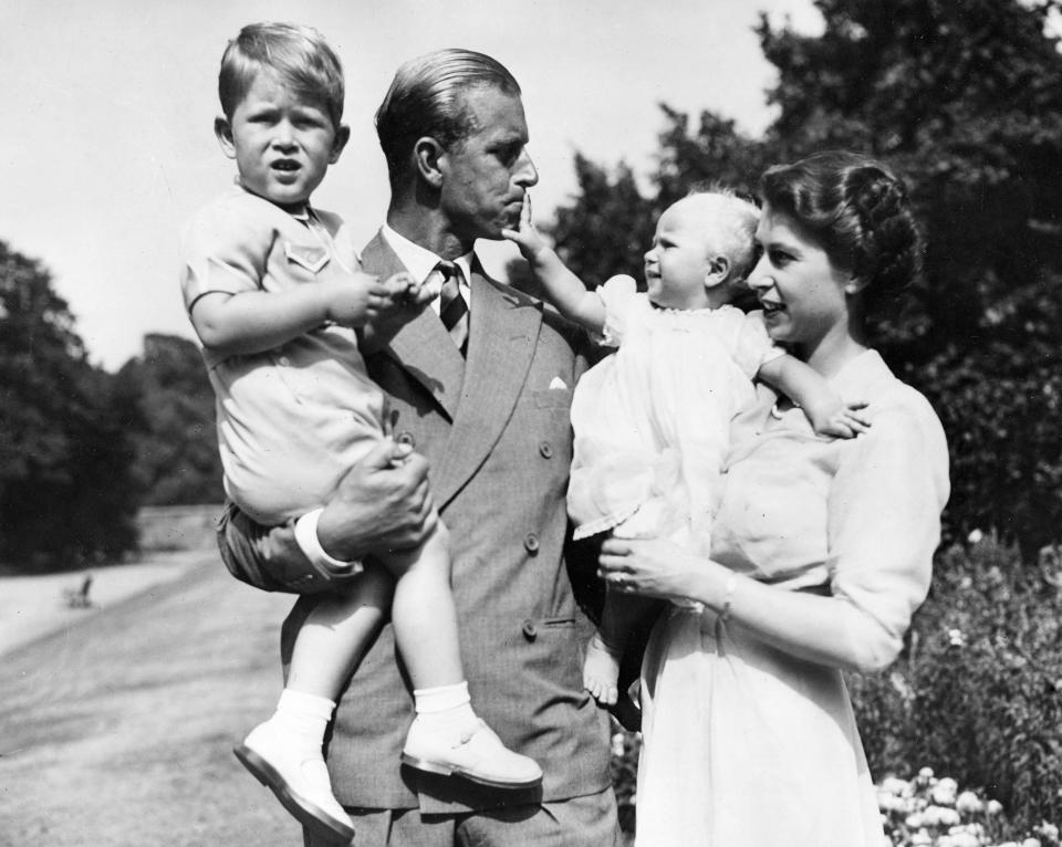 The then-Princess Elizabeth in the garden of Clarence House with Philip and their children Prince Charles and Princess Anne in 1951.Keystone Press Agency/Shutterstock