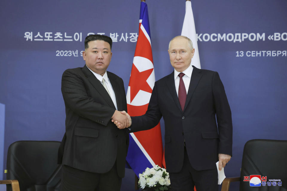 In this photo provided by the North Korean government, North Korean leader Kim Jong Un, left, and Russian President Vladimir Putin shake hands as they pose for a photo before their talk at the Vostochny cosmodrome outside the city of Tsiolkovsky, about 200 kilometers (125 miles) from the city of Blagoveshchensk in the far eastern Amur region, Russia, Wednesday, Sept. 13, 2023. Independent journalists were not given access to cover the event depicted in this image distributed by the North Korean government. The content of this image is as provided and cannot be independently verified. Korean language watermark on image as provided by source reads: "KCNA" which is the abbreviation for Korean Central News Agency. (Korean Central News Agency/Korea News Service via AP)