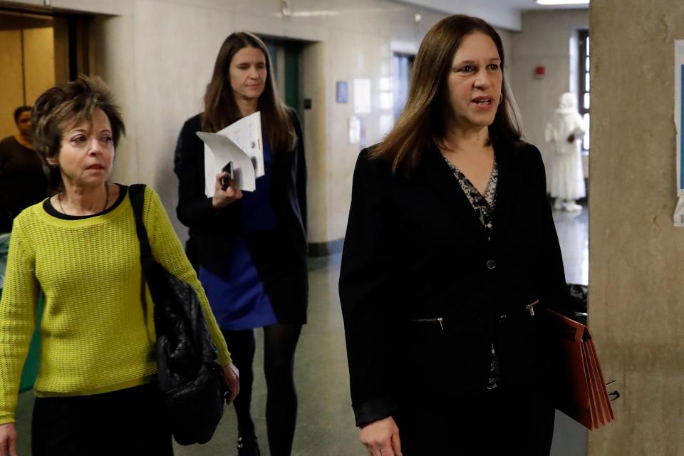 Manhattan Assistant District Attorney Joan Illuzzi, right, followed by ADA Meghan Hast, arrive for defense closing arguments at the Harvey Weinstein sex-crimes trial in New York, Feb. 13, 2020.