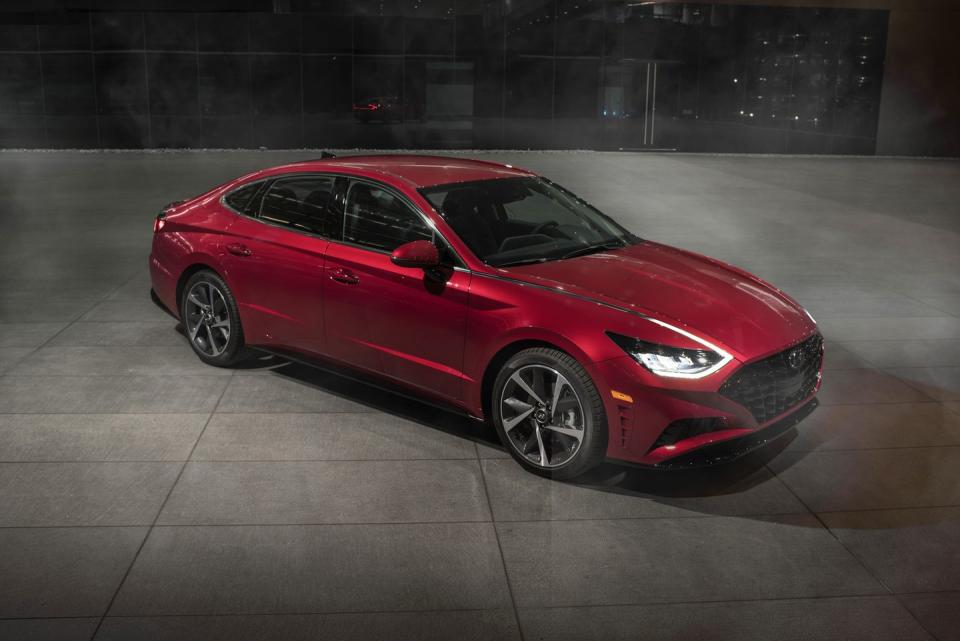 <p>With mid-size sedan sales slowing industry-wide as customers flock to crossovers and SUVs, Hyundai bets big on the Sonata's styling once again. <a href="https://www.caranddriver.com/reviews/a26952218/2020-hyundai-sonata-design-prototype-drive/" rel="nofollow noopener" target="_blank" data-ylk="slk:The 2020 Sonata;elm:context_link;itc:0;sec:content-canvas" class="link ">The 2020 Sonata</a>, which goes on sale in the fall of 2019, goes even more daring than did the knockout sixth-generation model. Although Hyundai promises Sonata prices won't rise much, <a href="https://www.caranddriver.com/news/g26960657/hyundai-sonata-new-features-2020/" rel="nofollow noopener" target="_blank" data-ylk="slk:there is a host of new features;elm:context_link;itc:0;sec:content-canvas" class="link ">there is a host of new features</a>, including sweet LED running lamps that blend into the hood. This Sonata is the first Hyundai in which owners can use a smartphone to lock, unlock, and start the car. There also is a full roster of driver-assistance and safety features, and the Sonata can even be pulled into or out of a tight parking spot via remote control.</p>