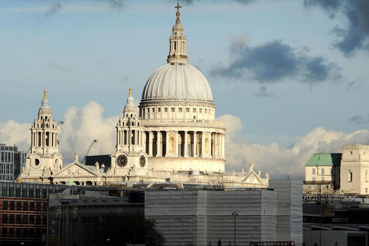 Unmarred: A clear view of the sky around the upper part of the dome of St Paul's: PA