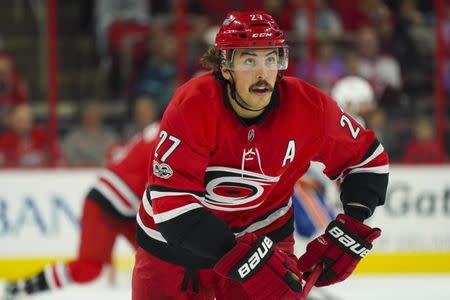 Nov 19, 2017; Raleigh, NC, USA; Carolina Hurricanes defensemen Justin Faulk (27) looks on against the New York Islanders at PNC Arena. The Carolina Hurricanes defeated the New York Islanders 4-2. James Guillory-USA TODAY Sports