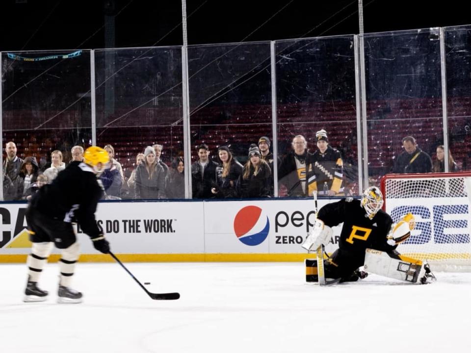 Mike Chiasson, right, is shown at a practice at Boston's Fenway Park on Jan. 1, 2023. Chiasson, from Cole Harbour, N.S., is Pittsburgh's emergency backup goalie. (Submitted by Mike Chiasson - image credit)