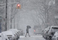 <p>A man crosses the street in heavy snow in Hoboken, N.J., March 7, 2018. (Photo: Seth Wenig/AP) </p>