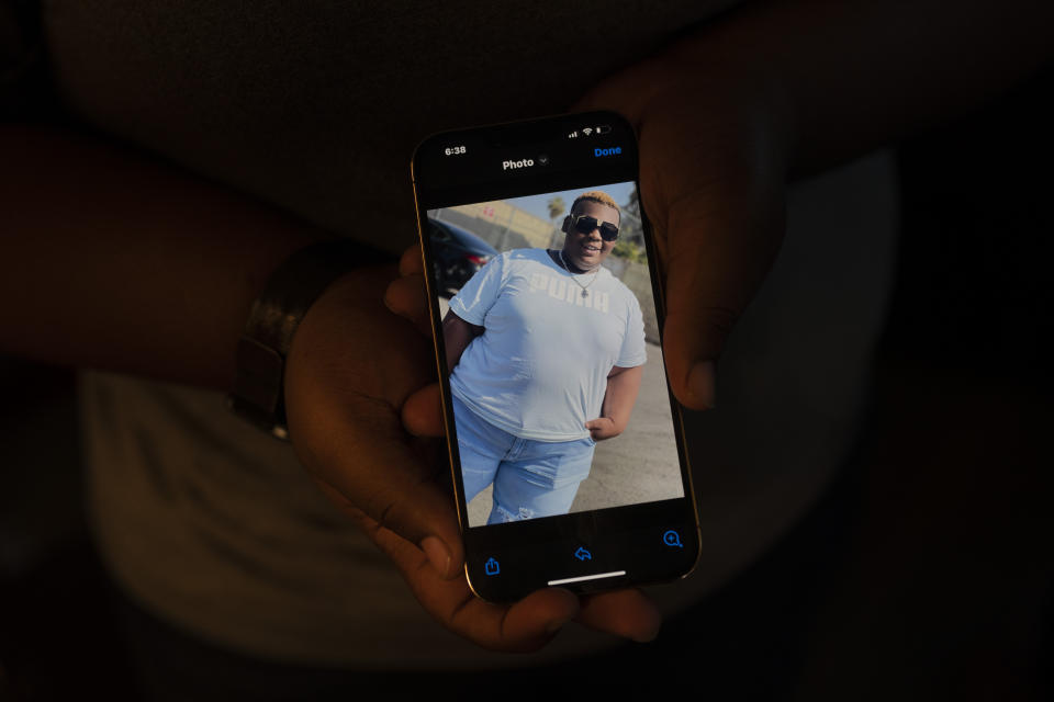 John Simon, a teenager who had a bariatric surgery in 2022, shows a photo of him before the surgery in Los Angeles, Monday, March 13, 2023. (AP Photo/Jae C. Hong)