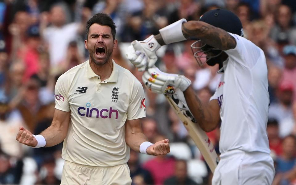 England's James Anderson (left) celebrates taking the wicket of India's KL Rahul to 84 on the third day of the first cricket Test match