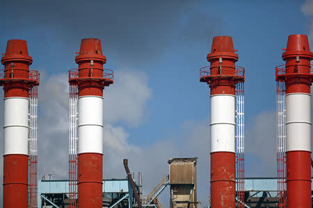 The chimneys of the Central San Juan power station of the Puerto Rico Electric Power Authority (PREPA) are seen in San Juan, Puerto Rico January 23, 2018. REUTERS/Alvin Baez