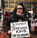 <p>Pam Campos, U.S. Air Force veteran and daughter of a Honduran immigrant, holds a sign calling on New York Sen. Chuck Schumer, Rep. Dan Donovan of Staten Island, and Rep. Pete King, who represents a large part of Long Island, to reject any version of a government spending bill that doesnât include the DREAM Act. Campos was one of a handful of representatives from Common Defense, a national grassroots organization of veterans and military family members, who showed up to demonstrate outside Schumerâs office in New York City Wednesday, Jan. 17, 2018. (Photo: Caitlin Dickson/Yahoo News) </p>