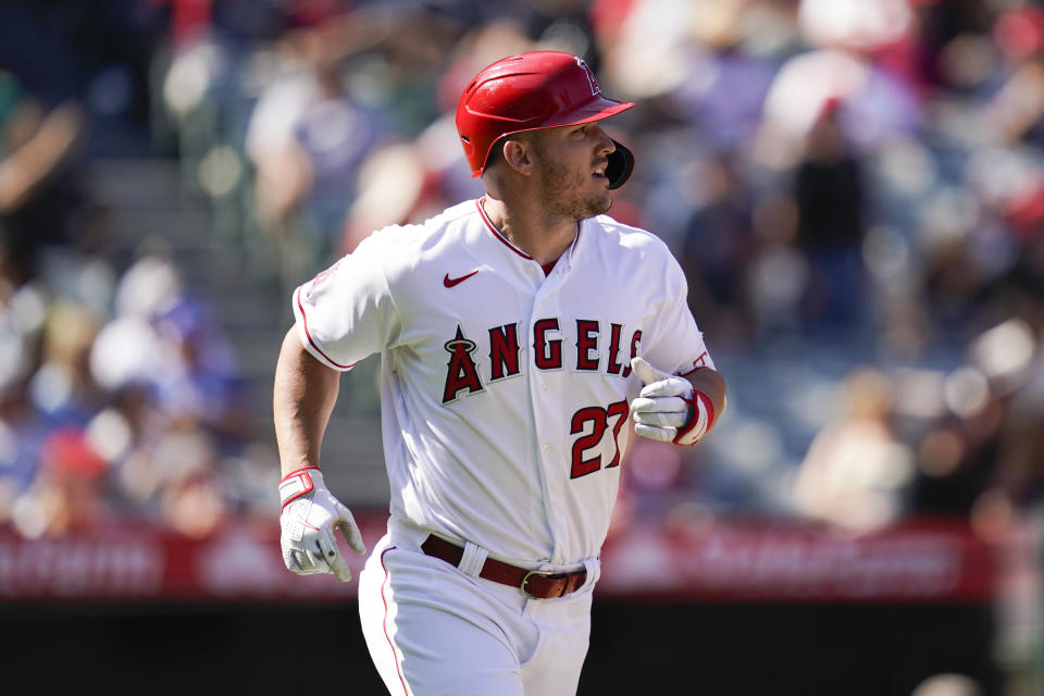 Los Angeles Angels' Mike Trout (27) runs the bases after hitting a home run during the fourth inning of a baseball game against the Texas Rangers in Anaheim, Calif., Sunday, Oct. 2, 2022. (AP Photo/Ashley Landis)