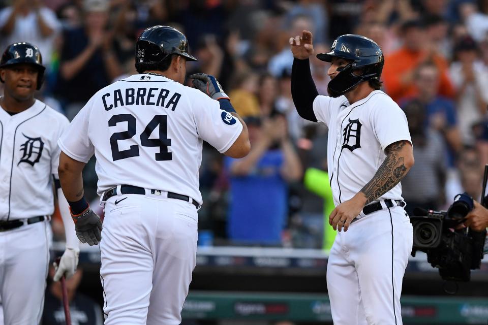 Detroit Tigers' Eric Haase, right, is congratulated by Miguel Cabrera after hitting a grand slam in the third inning of a baseball game against the San Diego Padres, Monday, July 25, 2022, in Detroit.