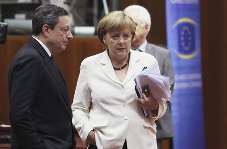 European Central Bank (ECB) President Mario Draghi (L) talks to Germany's Chancellor Angela Merkel during a European Union leaders summit in Brussels in this June 29, 2012 file photo. REUTERS/Francois Lenoir/Files