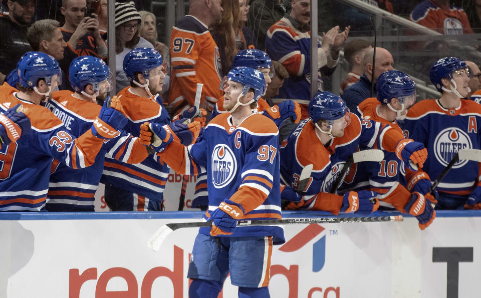 Edmonton Oilers' Connor McDavid (97) celebrates a goal against the Anaheim Ducks during the first period of an NHL hockey game in Edmonton, Alberta on Saturday March 30, 2024. (Jason Franson/The Canadian Press via AP)