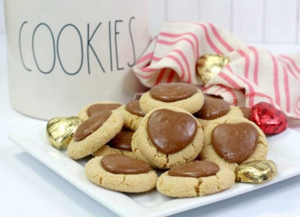 <p>Parade</p><p>Heart-shaped chocolate is nestled into peanut butter cookies for a cute Valentine's Day's treat.</p><p><strong>Get the recipe: <a href="/1155093/pambeth/chocolate-sweetheart-peanut-butter-cookies/" data-ylk="slk:Chocolate Sweetheart Peanut Butter Cookies;elm:context_link;itc:0;sec:content-canvas" class="link ">Chocolate Sweetheart Peanut Butter Cookies</a></strong></p>