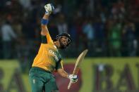 South Africa's Jean-Paul Duminy celebrates his team's victory over India during their first Twenty-20 cricket match in the northern Indian hill town of Dharamsala, India, October 2, 2015. REUTERS/Adnan Abidi