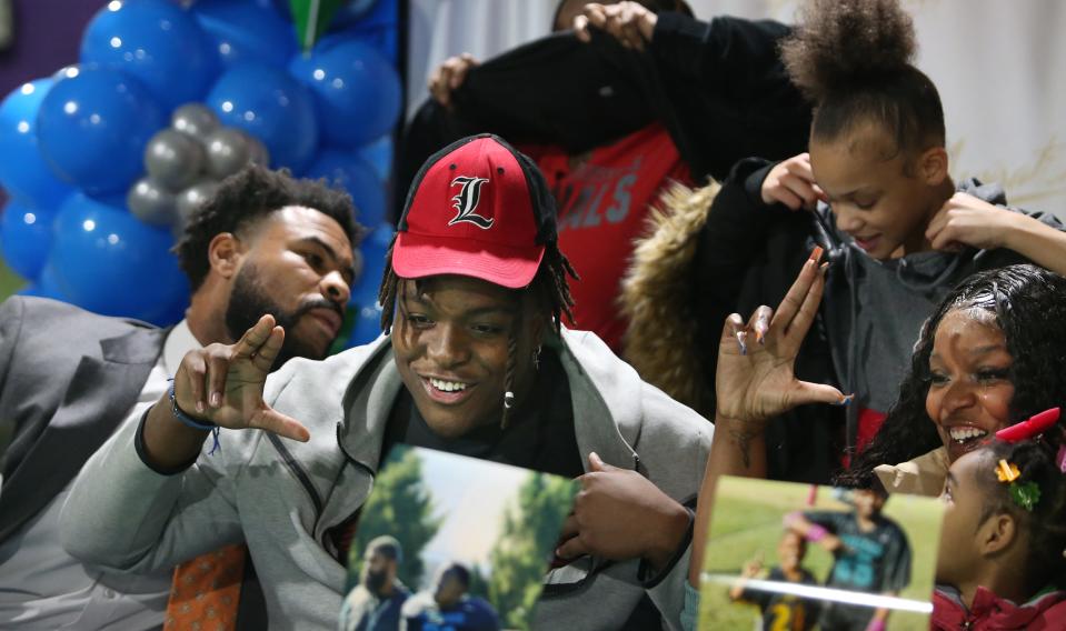 William Spencer showed the “L”, a shirt and the Louisville hat  to announce he was selecting the Cardinals next year.
Feb. 1, 2023