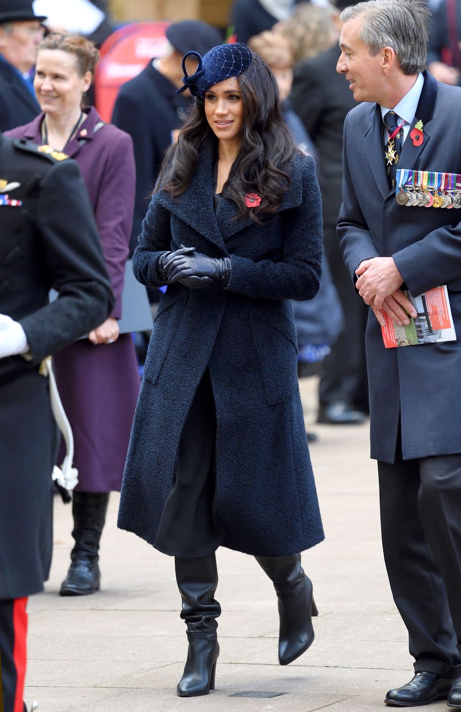 <p>For her official appearance on remembrance day in 2019, the Duchess of Sussex wore a subdued navy ensemble topped with a navy boucle Sentaler coat. </p>