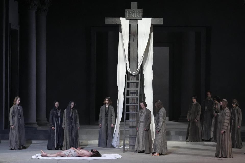 Rochus Rueckel as Jesus, left, performs during the rehearsal of the 42nd Passion Play in Oberammergau, Germany, Wednesday, May 4, 2022. More than 1800 citizens of this Bavarian village participate in the century-old play of the suffering of Christ, staged every ten years and dating back to 1634. (AP Photo/Matthias Schrader)