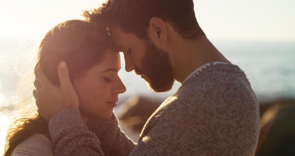 Cropped shot of a young couple spending the day at the beach