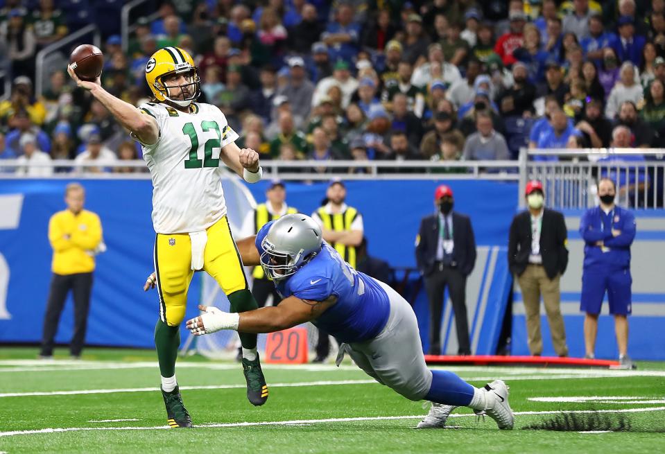 Aaron Rodgers of the Green Bay Packers throws a pass during the first quarter against the Detroit Lions at Ford Field on Jan. 9, 2022.