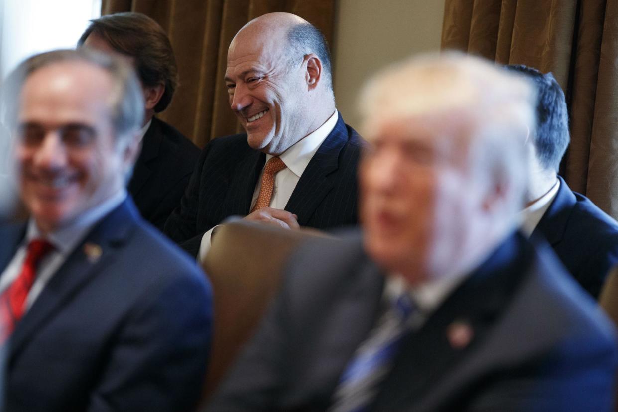 Outgoing White House chief economic adviser Gary Cohn laughs as President Donald Trump talks about him during a cabinet meeting at the White House: AP