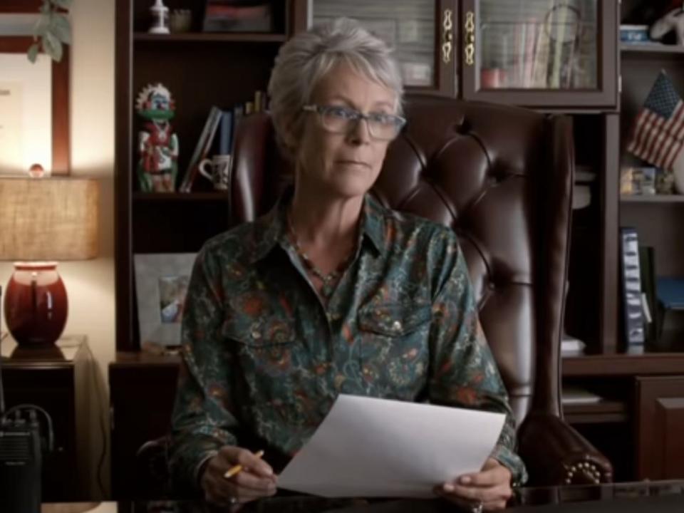 Principal Karen Lowry sitting behind her desk in spare parts