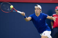 Sebastián Báez, of Argentina, returns to Nick Kyrgios, of Australia, during the National Bank Open tennis tournament Tuesday, Aug. 9, 2022, in Montreal. (Paul Chiasson/The Canadian Press via AP)