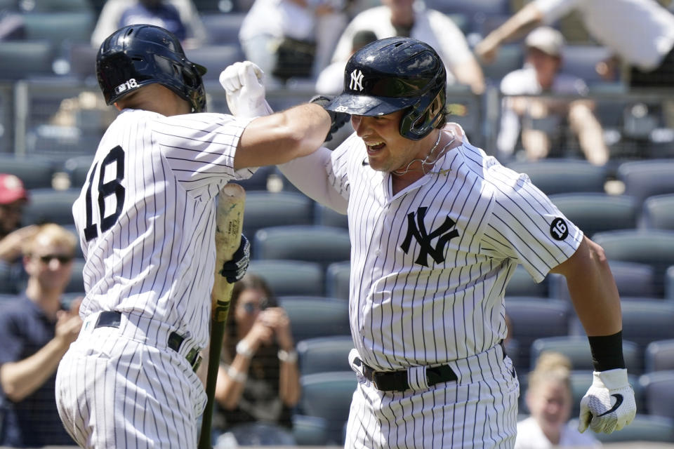 New York Yankees' Rougned Odor (18) greets Luke Voit after Voit hit a solo home run during the third inning of a baseball game against the Kansas City Royals, Thursday, June 24, 2021, at Yankee Stadium in New York. (AP Photo/Kathy Willens)