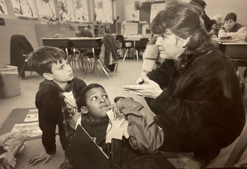 At Alimicani Elementary School in February 1995, Chris Hayes (left) and Rasheed Abdullah listen to instructor Linda Zeiler during a class discussion on Black history. The previous year, the state mandated that schools should teach Black history. Zeiler was a member of a state task force charged with figuring out how to incorporate he subject into schools.