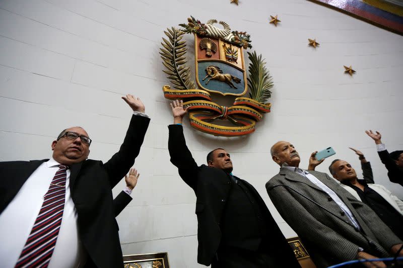 Government backed lawmakers take part in a swearing in ceremony at Venezuela's National Assembly building in Caracas
