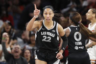 Las Vegas Aces center A'ja Wilson (22) celebrates after making a basket against the Phoenix Mercury during the first half of a WNBA basketball game Tuesday, May 21, 2024, in Las Vegas. (Steve Marcus/Las Vegas Sun via AP)
