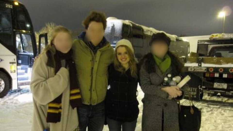 the author and her fellow traveling cast members in front of their tour buses