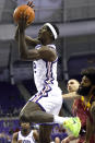 TCU forward Emanuel Miller (2) goes to the basket as Louisiana-Monroe guard Jamari Blackmon defends during the first half of an NCAA college basketball game Thursday, Nov. 17, 2022, in Fort Worth, Texas. (AP Photo/Ron Jenkins)