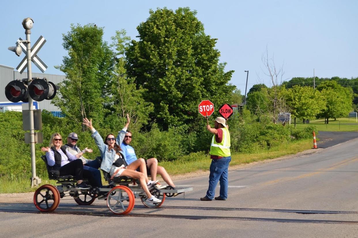 Customers ride rail bikes in Grawn, 10 miles outside of Traverse City, during Wheels on Rails opening season in summer 2023.