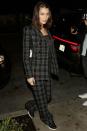 <p>In a plaid Dior suit from the French fashion house's fall 2018 collection, sheer top, white shoulder bag, and black sneakers while out in LA.</p>