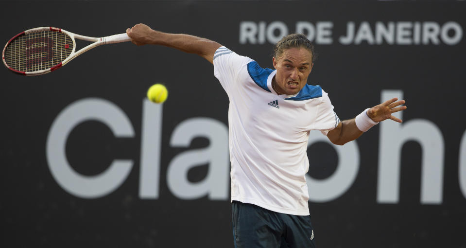 Alexandr Dolgopolovof Ukraine returns the ball to David Ferrer of Spain at the Rio Open tennis tournament in Rio de Janeiro, Brazil, Saturday, Feb. 22, 2014. (AP Photo/Leo Correa)