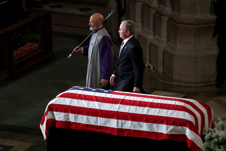 3) George W. Bush leaves the podium after speaking.