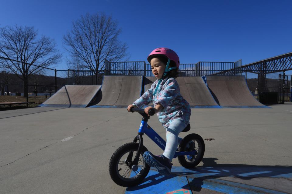 Aya Sofia Niemeyer of Newburgh gets to ride her balance bike on a 60 degree day in the City of Poughkeepsie on February 15, 2023.