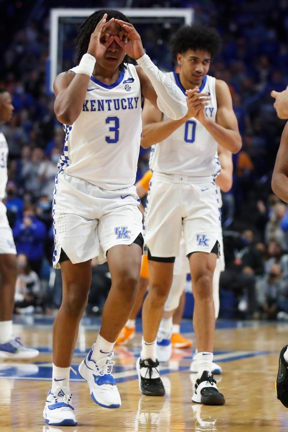 TyTy Washington (3) and Jacob Toppin (0) celebrate during Kentucky’s blowout win over Tennessee last Saturday. The Wildcats say now is not the time for the team to lose focus.