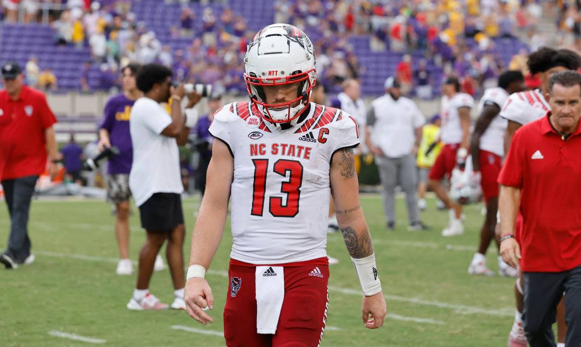 N.C. State quarterback Devin Leary (13) walks off the field after N.C. States 21-20 victory over ECU at Dowdy-Ficklen Stadium in Greenville, N.C., Saturday, Sept. 3, 2022.