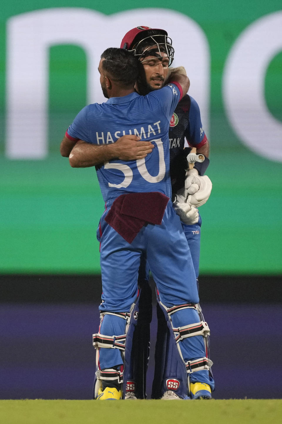 Afghanistan's Rahmat Shah, facing camera, and Afghanistan's captain Hashimatullah Shahidi, celebrate their win against Pakistan during the ICC Men's Cricket World Cup match between Pakistan and Afghanistan in Chennai, India, Monday, Oct. 23, 2023. (AP Photo/Anupam Nath)