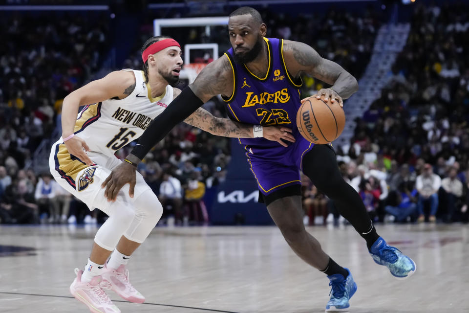 Los Angeles Lakers forward LeBron James (23) drives to the basket against New Orleans Pelicans guard Jose Alvarado (15) in the second half of an NBA basketball game in New Orleans, Sunday, Dec. 31, 2023. The Pelicans won 129-109. (AP Photo/Gerald Herbert)