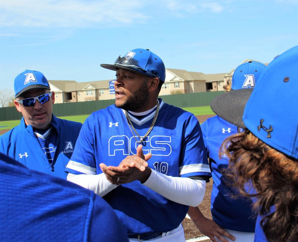 Abilene Christian High coach Phillip Hall talks to his players about what he liked about Saturday's win over Lubbock Trinity. He urged his team to continue to play "gritty" baseball, which they did in a 3-2 come-from-behind win.