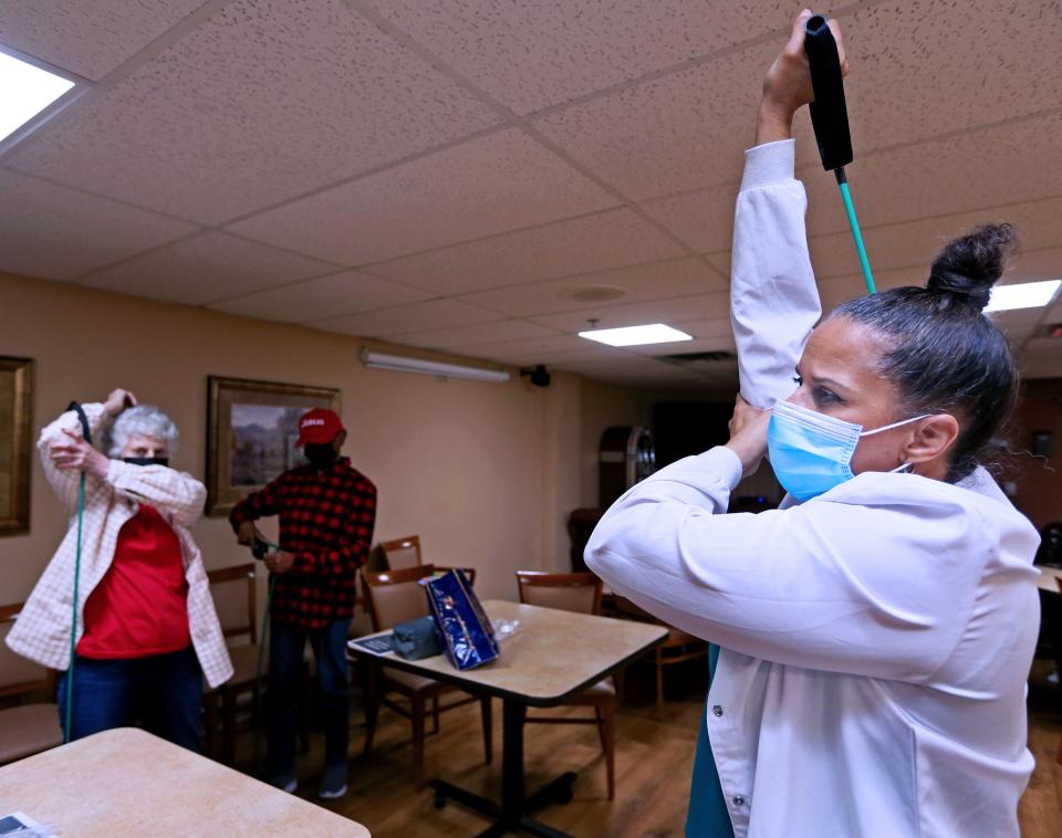 Ascension Wisconsin parish nurse Brenda Buchanan, right, teaches a Check, Change and Control exercise class at Jefferson Court, a Mercy Housing Senior Community in Milwaukee. Connie Butler, left, and Ernestine Williams participate. The class, sponsored by the American Heart Association, introduces seniors to healthy eating, stress management, skills to control blood pressure and fitness.