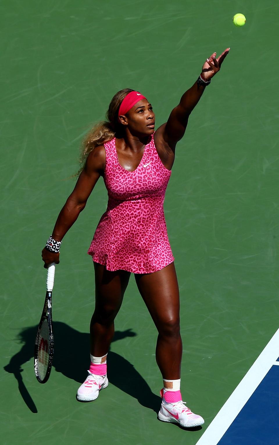 Serena Williams of the United States serves against Vania King of the United States during their women's singles second round match on Day Four of the 2014 US Open at the USTA Billie Jean King National Tennis Center on August 28, 2014 in the Flushing neighborhood of the Queens borough of New York City