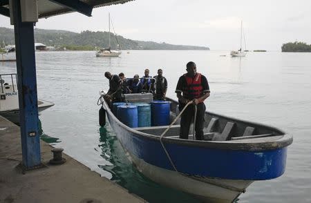 Members of Jamaica's Marine Police return to port after leaving the site where it is presumed a small U.S. private plane with an unresponsive pilot crashed off the east coast of Jamaica, in Port Antonio September 5, 2014. REUTERS/Gilbert Bellamy