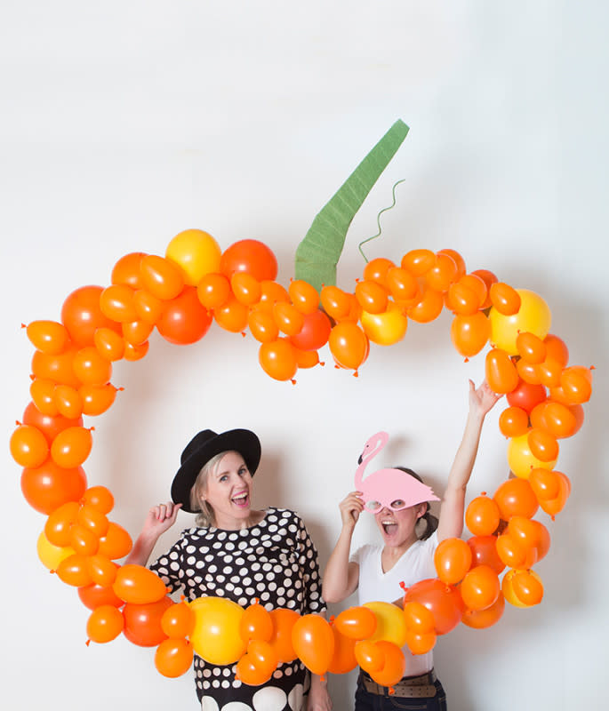 <p>The House That Lars Built</p><p>Looking to bring a little pumpkin spice love to the party? Check out <a href="http://thehousethatlarsbuilt.com/2015/10/diy-pumpkin-balloon-backdrop.html/" rel="nofollow noopener" target="_blank" data-ylk="slk:The House That Lars Built;elm:context_link;itc:0;sec:content-canvas" class="link rapid-noclick-resp">The House That Lars Built</a> on how to bring this terrifyingly cute backdrop to life! </p>