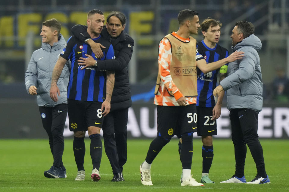 Inter Milan's head coach Simone Inzaghi embraces Inter Milan's Marko Arnautovic after the Champions League, round of 16, first leg soccer match between Inter Milan and Atletico Madrid, at the San Siro stadium in Milan, Italy, Tuesday, Feb. 20, 2024. (AP Photo/Luca Bruno)