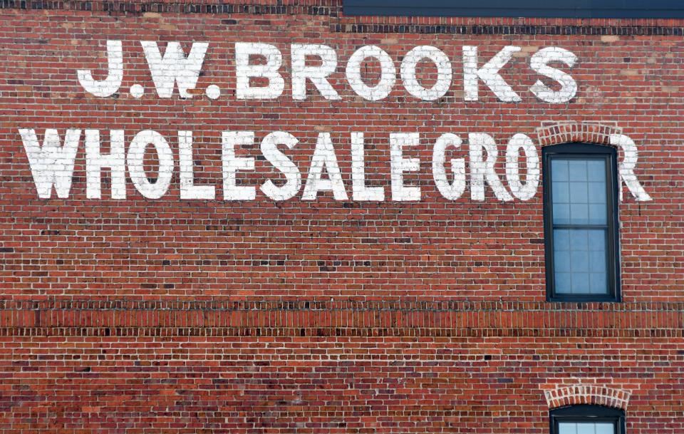 "J.W. Brooks Wholesale Grocer" is painted onto the brick building at 18 S. Water St. in downtown Wilmington.   [MATT BORN/STARNEWS]